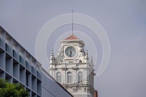 Clock tower of building near Plaza San Martin at Rivadavia and Rosario de Santa Fe street corner - Cordoba, Argentina photo