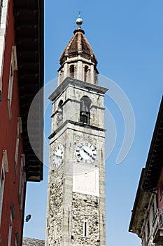 Clock tower of Chiesa Parrocchiale dei Santi Pietro e Paolo at center square in Ascona, Locarno, Switzerland