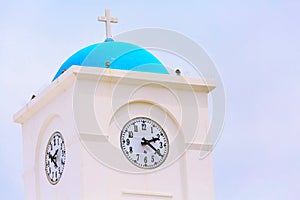 Clock tower of church in Milos island, Greece