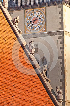 Clock on the tower of Church of St. Egidius  on Town hall square in Bardejov town during summer evening