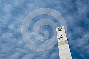 Clock tower on cloudy blue sky