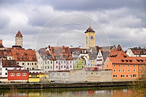Clock tower and colorful old buildings in Regensburg