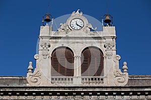 Clock tower on the facade of the Palazzo Tezzano