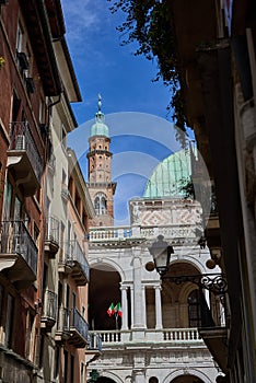 Clock tower of the famous Basilica Palladiana Palazzo della Ragione decked out with Italian flags
