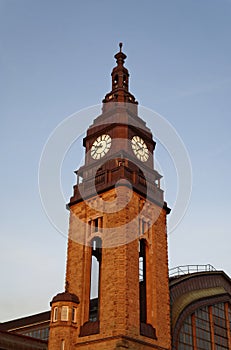 Clock tower Hauptbahnhof Hamburg in the evening red in Germany Europe