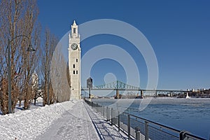 Clock tower and Jacques cartier bridge in the Old port of Montreal