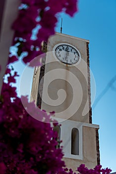 Clock tower in Oia village, Santorini island, Greece