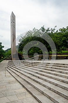 Clock Tower Over Stepped Plaza with Tree?Lined Border