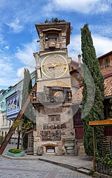 Clock Tower of puppet theater Rezo Gabriadze in historical center of old Tbilisi, Georgia photo
