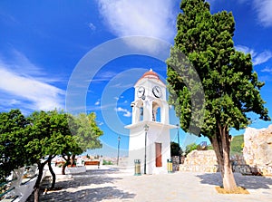 Clock tower in Skiathos, Greece against the blue sky