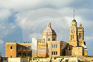 Clock tower of St Michael\'s Bastion and Senglea Paris Church. Senglea, Malta, Europe