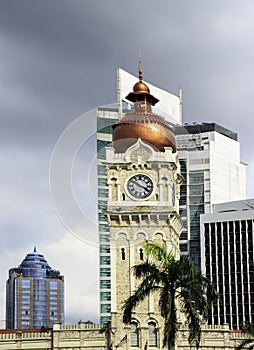 Clock tower of Sultan Abdul Samad building with modern buildings.