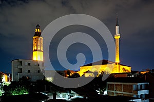 Clock tower and Sultan Murati minaret in Skopje (Macedonia