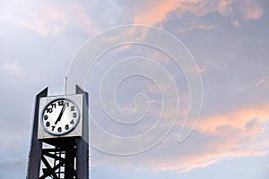 Clock tower at time: 5 p.m. on sky cloudy sunset background, Clock tower at park on beautiful sky colorful background, isolated