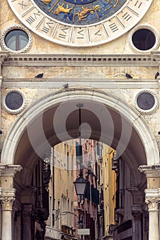 Clock tower Torre dell`Orologio at Piazza San Marco or St Mark`s square, Venice, Italy. It is old landmark of Venice photo