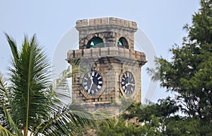 A clock tower with two clocks on it