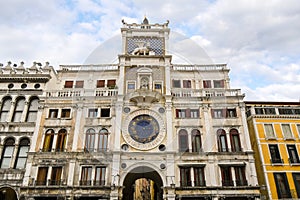 The clock tower with lion in Venice, Italy photo