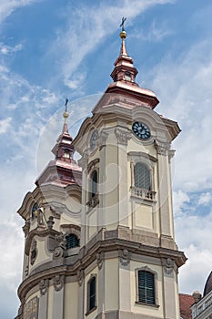 Clock towers Minorite church at Eger main square in Hungary