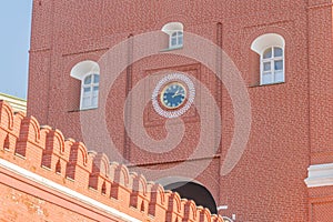 Clock of the Troitskaya Tower Trinity Tower and fragment of kremlin wall