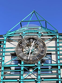 Clock on the wall of the building