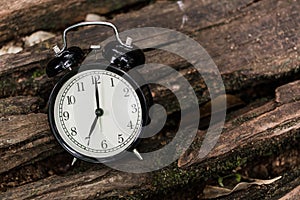 Clock on wood background time at 7 o`clock
