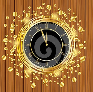 Clock on a wooden background with gold spangles