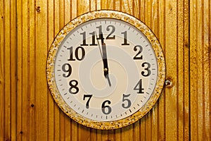 Clock on wooden wall