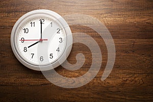 Clock on wooden wall