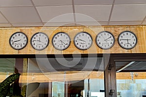 Clocks showing the time in different countries