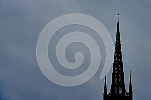 Clocktower of Stockholm Cathedral - Riddarholmskyrkan church against a cloudy sky.