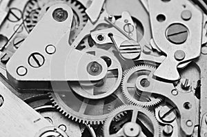 Clockwork, black-and-white gears in an watch. Teamwork concept, idea, technology, eternity, business. Macro. Design minimalism,