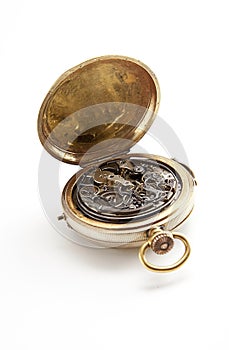 Clockwork inside pocket stopwatch over white background