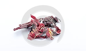 Cloeup of heap of dried red hibiscus petals on the white background photo