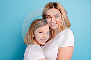 Cloeup profile photo of two people beautiful mommy lady small little daughter blonds hugging good mood best friends wear photo