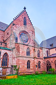 The cloister of Basel Minster and window rose on the transept, Basel, Switzerland