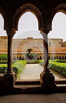 Cloister of the Benedictine monastery in the Cathedral of Monreale in Sicily. General view and details of the columns and capitals