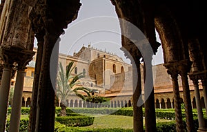 Cloister of the Benedictine monastery in the Cathedral of Monreale in Sicily. General view and details of the columns and capitals