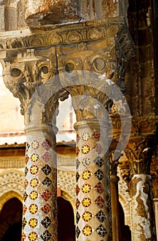 Cloister of the Benedictine monastery in the Cathedral of Monreale in Sicily. General view and details of the columns and capitals