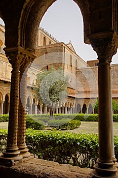 Cloister of the Benedictine monastery in the Cathedral of Monreale in Sicily. General view and details of the columns and capitals