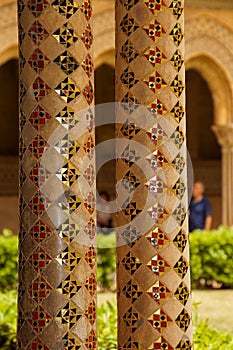 Cloister of the Benedictine monastery in the Cathedral of Monreale in Sicily. General view and details of the columns and capitals