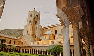 Cloister of the Benedictine monastery in the Cathedral of Monreale in Sicily. General view and details of the columns and capitals