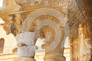 Cloister of the Benedictine monastery in the Cathedral of Monreale in Sicily. General view and details of the columns and capitals