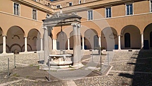 Cloister with fountain and well