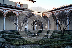 Cloister of Santa Maria delle Grazie, view in contrast of afternoon light and shadows, Milan, Italy