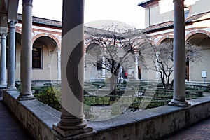 Cloister of Santa Maria delle Grazie, view in contrast of afternoon light and shadows, Milan, Italy