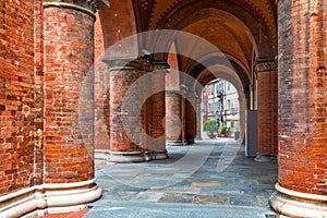 Cloistered arches at the entrance to San Lorenzo Cathedral in Alba. photo
