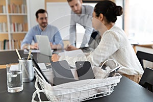 Close of basket with smartphones forbidden at corporate meeting