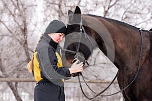 Close bond between person and horse in winter