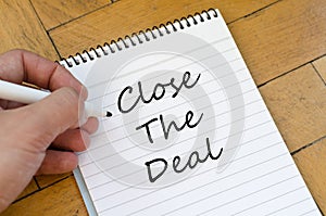 Close the deal concept on notebook