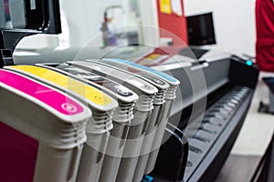 Close detail of ink cartridges in plotter for printing